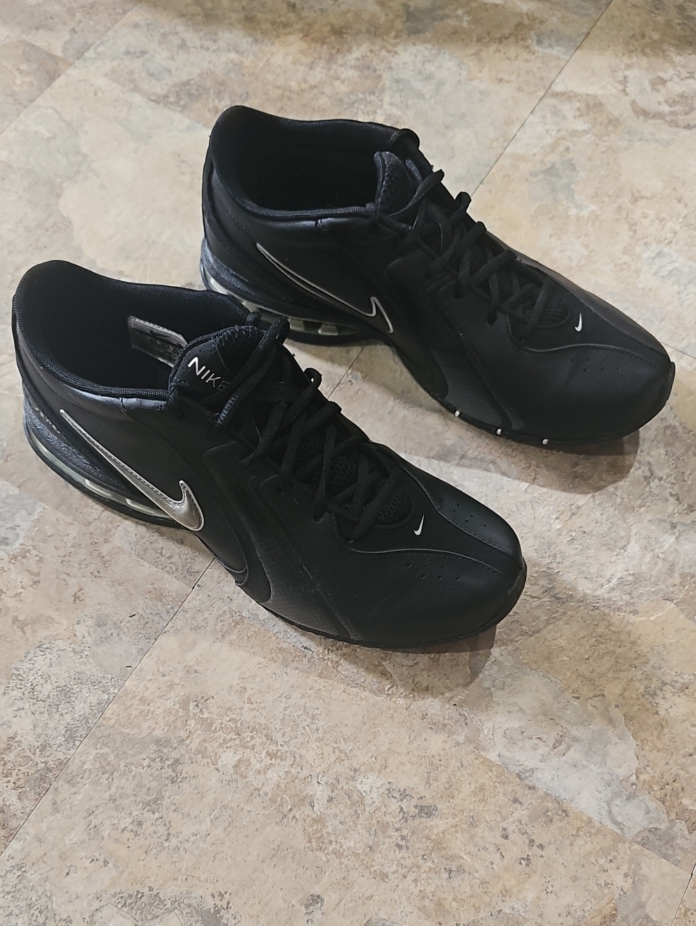 Nike Men’s Black Leather Athletic Shoes with Silver Swoosh